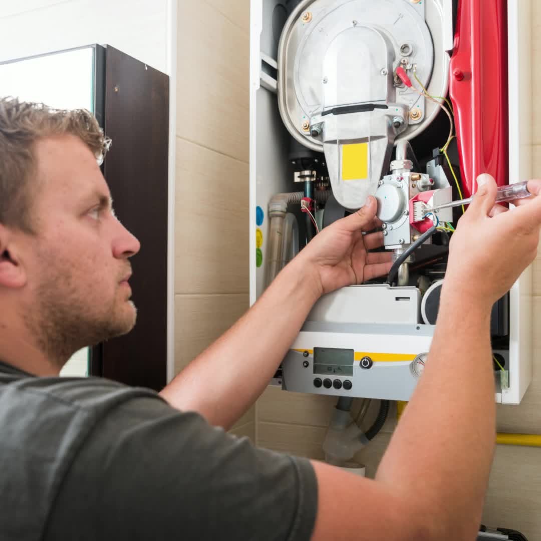 - RA Hoy Heating & Air Conditioning R.A. Hoy technician tuning up a furnace